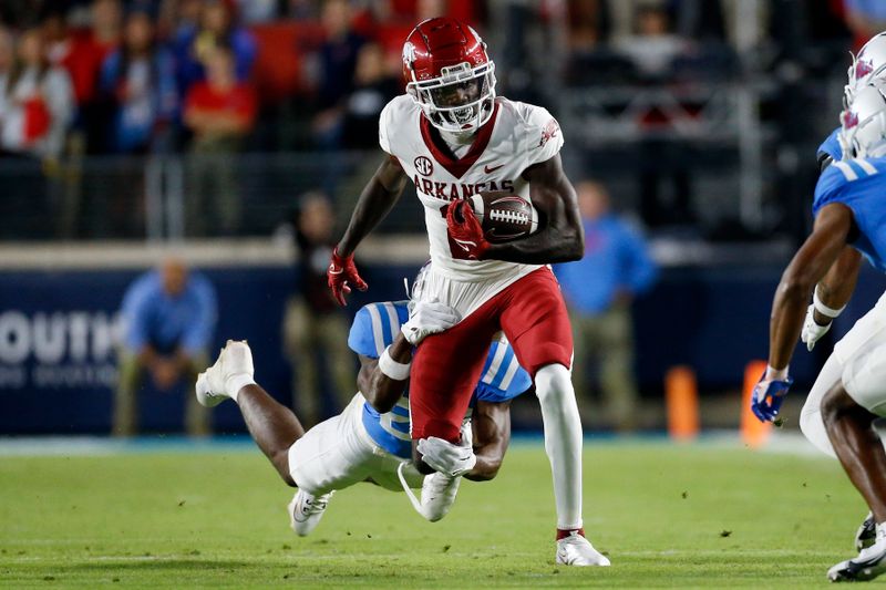 Oct 7, 2023; Oxford, Mississippi, USA; Arkansas Razorbacks wide receiver Andrew Armstrong (2) runs after a catch as Mississippi Rebels defensive back Trey Washington (25) makes the tackle during the first half at Vaught-Hemingway Stadium. Mandatory Credit: Petre Thomas-USA TODAY Sports