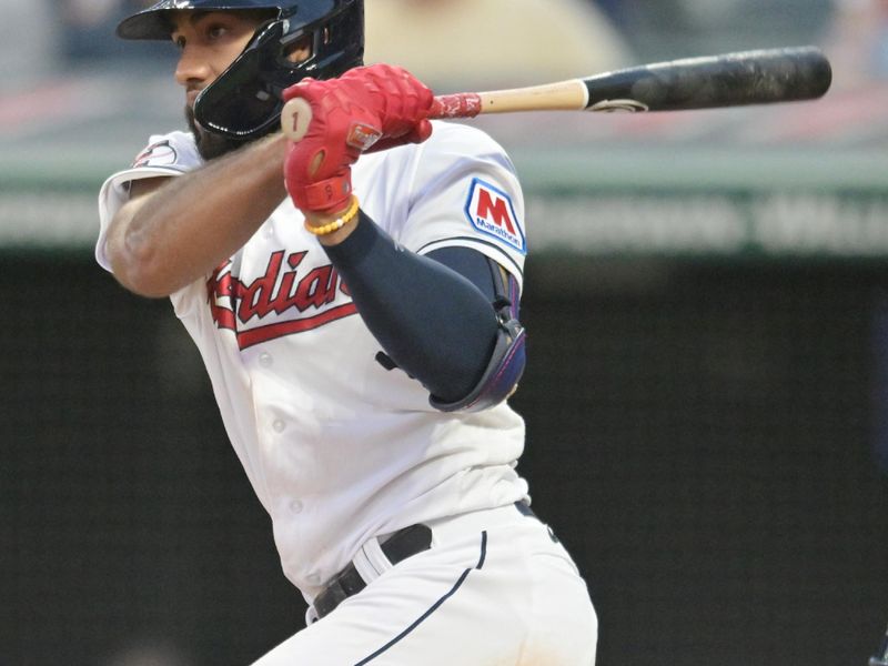 Jul 3, 2023; Cleveland, Ohio, USA; Cleveland Guardians shortstop Amed Rosario (1) hits an RBI single during the seventh inning against the Atlanta Braves at Progressive Field. Mandatory Credit: Ken Blaze-USA TODAY Sports