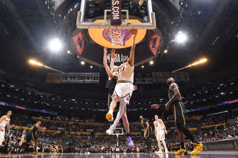 LOS ANGELES, CA - FEBRUARY 8: Jamal Murray #27 of the Denver Nuggets drives to the basket during the game against the Los Angeles Lakers on Feburary 8, 2024 at Crypto.Com Arena in Los Angeles, California. NOTE TO USER: User expressly acknowledges and agrees that, by downloading and/or using this Photograph, user is consenting to the terms and conditions of the Getty Images License Agreement. Mandatory Copyright Notice: Copyright 2024 NBAE (Photo by Andrew D. Bernstein/NBAE via Getty Images)