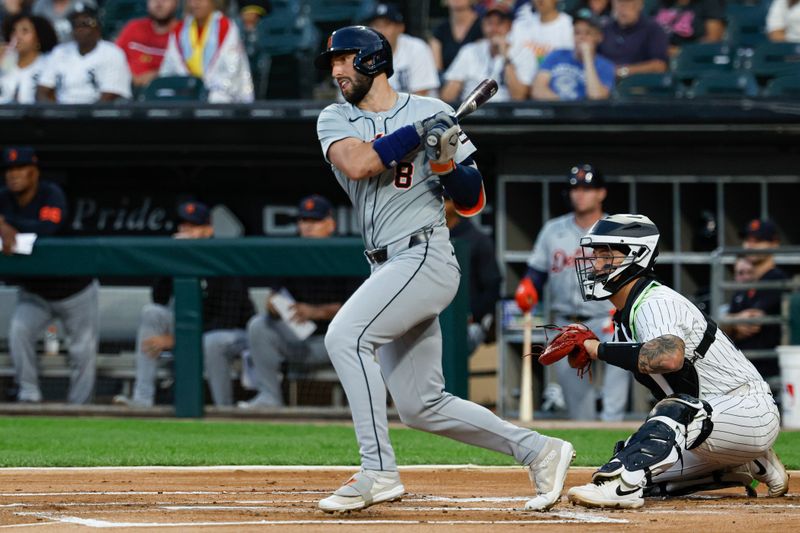 Aug 23, 2024; Chicago, Illinois, USA; Detroit Tigers outfielder Matt Vierling (8) hits an RBI-double against the Chicago White Sox during the first inning at Guaranteed Rate Field. Mandatory Credit: Kamil Krzaczynski-USA TODAY Sports