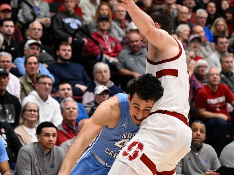 Jan 14, 2026; Stanford, California, USA; North Carolina Tar Heels guard Luka Bogavac (44) drives to the basket against Stanford Cardinal forward AJ Rohosy (4) in the second half at Maples Pavilion. Mandatory Credit: Eakin Howard-Imagn Images