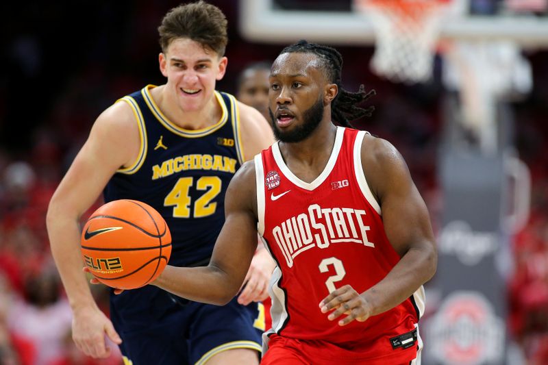 Mar 3, 2024; Columbus, Ohio, USA;  Ohio State Buckeyes guard Bruce Thornton (2) looks to pass as Michigan Wolverines forward Will Tschetter (42) defends during the second half at Value City Arena. Mandatory Credit: Joseph Maiorana-USA TODAY Sports