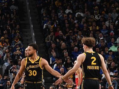 SAN FRANCISCO, CA - DECEMBER 22: Stephen Curry #30 high fives Brandin Podziemski #2 of the Golden State Warriors during the game against the Washington Wizards on December 22, 2023 at Chase Center in San Francisco, California. NOTE TO USER: User expressly acknowledges and agrees that, by downloading and or using this photograph, user is consenting to the terms and conditions of Getty Images License Agreement. Mandatory Copyright Notice: Copyright 2023 NBAE (Photo by Noah Graham/NBAE via Getty Images)