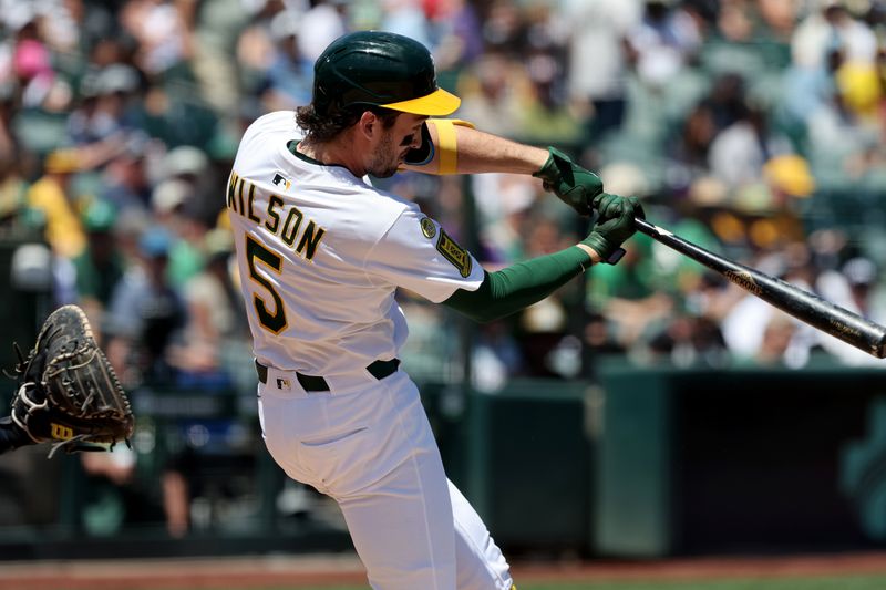 May 10, 2025; West Sacramento, California, USA; Athletics short stop Jacob Wilson (5) connects for a double against the New York Yankees during the first inning at Sutter Health Park. Mandatory Credit: Dennis Lee-Imagn Images