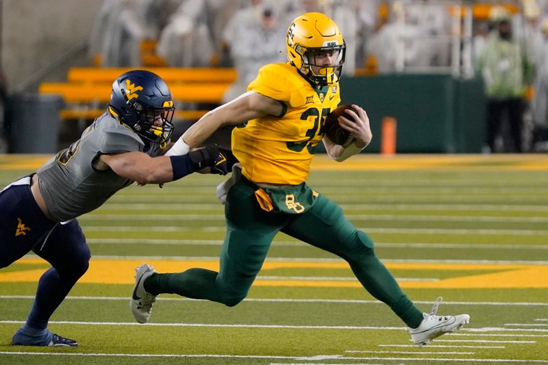 Nov 25, 2023; Waco, Texas, USA; Baylor Bears running back Dawson Pendergrass (35) carries the ball during the first half against the West Virginia Mountaineers at McLane Stadium. Mandatory Credit: Raymond Carlin III-USA TODAY Sports