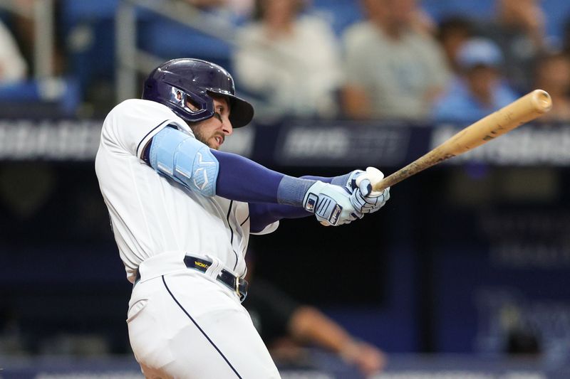 Aug 24, 2023; St. Petersburg, Florida, USA;  Tampa Bay Rays right fielder Josh Lowe (15) hits a three run home run against the Colorado Rockies in the eighth inning at Tropicana Field. Mandatory Credit: Nathan Ray Seebeck-USA TODAY Sports