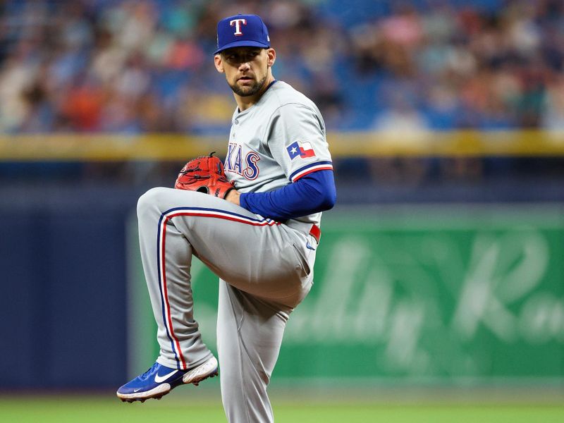 Apr 3, 2024; St. Petersburg, Florida, USA;  Texas Rangers starting pitcher Nathan Eovaldi (17) throws a pitch against the Tampa Bay Rays in the first inning at Tropicana Field. Mandatory Credit: Nathan Ray Seebeck-USA TODAY Sports