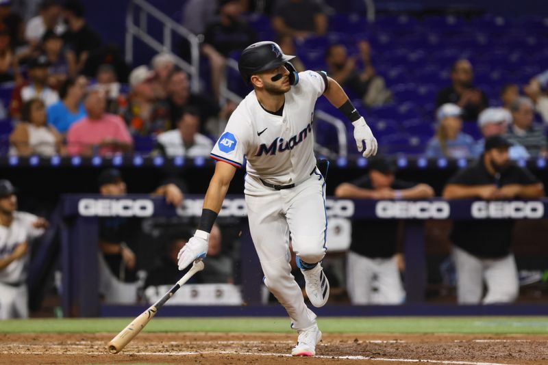 Sep 5, 2024; Miami, Florida, USA; Miami Marlins designated hitter Connor Norby (24) runs toward first base after hitting a single against the Philadelphia Phillies during the third inning at loanDepot Park. Mandatory Credit: Sam Navarro-Imagn Images