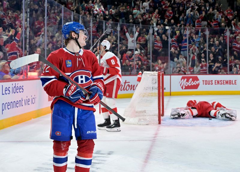 Apr 16, 2024; Montreal, Quebec, CAN; Montreal Canadiens forward Cole Caufield (22) celebrates after scoring a goal against Detroit Red Wings goalie James Reimer (47) during the second period at the Bell Centre. Mandatory Credit: Eric Bolte-USA TODAY Sports