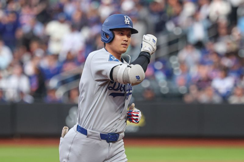 May 25, 2025; New York City, New York, USA; Los Angeles Dodgers designated hitter Shohei Ohtani (17) rounds the bases after a solo home run during the first inning against the New York Mets at Citi Field. Mandatory Credit: Vincent Carchietta-Imagn Images