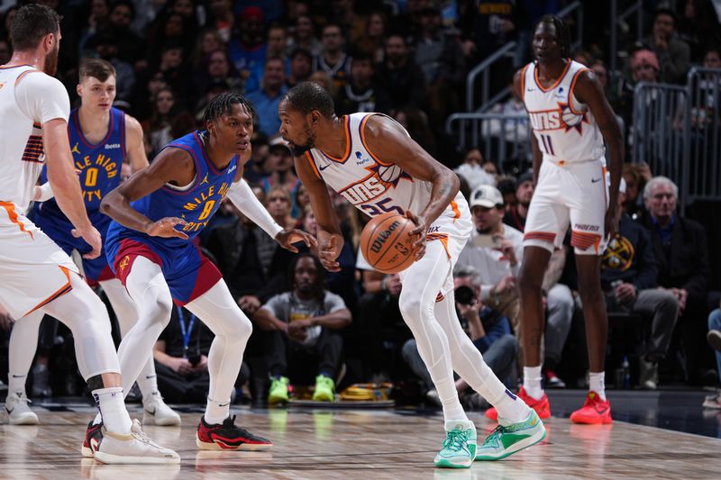 DENVER, CO - MARCH 5: Kevin Durant #35 of the Phoenix Suns dribbles the ball during the game against the Denver Nuggets on March 5, 2024 at the Ball Arena in Denver, Colorado. NOTE TO USER: User expressly acknowledges and agrees that, by downloading and/or using this Photograph, user is consenting to the terms and conditions of the Getty Images License Agreement. Mandatory Copyright Notice: Copyright 2024 NBAE (Photo by Garrett Ellwood/NBAE via Getty Images)