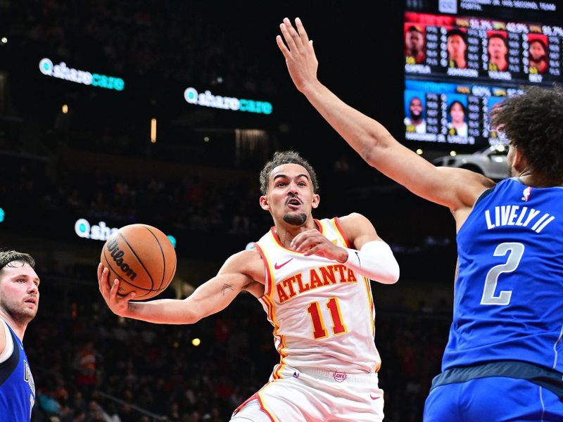 ATLANTA, GA - JANUARY 26: Trae Young #11 of the Atlanta Hawks drives to the basket during the game against the Dallas Mavericks on January 26, 2024 at State Farm Arena in Atlanta, Georgia.  NOTE TO USER: User expressly acknowledges and agrees that, by downloading and/or using this Photograph, user is consenting to the terms and conditions of the Getty Images License Agreement. Mandatory Copyright Notice: Copyright 2024 NBAE (Photo by Adam Hagy/NBAE via Getty Images)
