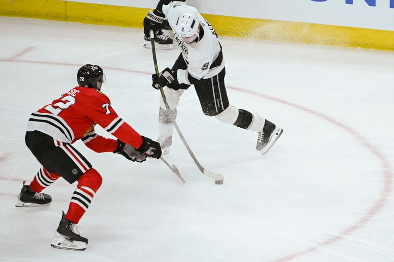 Mar 3, 2025; Chicago, Illinois, USA;  Los Angeles Kings right wing Adrian Kempe (9) moves the puck against Chicago Blackhawks defenseman Alex Vlasic (72) during the second period at the United Center. Mandatory Credit: Matt Marton-Imagn Images