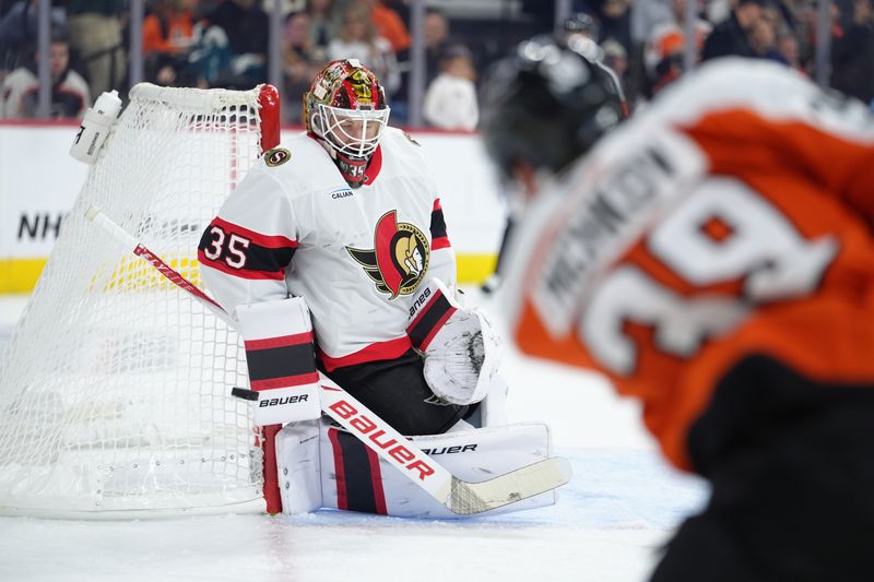 Nov 8, 2025; Philadelphia, Pennsylvania, USA; Ottawa Senators goaltender Linus Ullmark (35) saves a shot against Philadelphia Flyers right wing Matvei Michkov (39) in the second period at Xfinity Mobile Arena. Mandatory Credit: Kyle Ross-Imagn Images