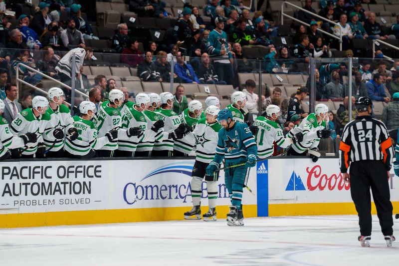 Jan 18, 2023; San Jose, California, USA; Dallas Stars left wing Jason Robertson (21) celebrates with teammates after the goal during the second period in front of San Jose Sharks defenseman Mario Ferraro (38) at SAP Center at San Jose. Mandatory Credit: Neville E. Guard-USA TODAY Sports