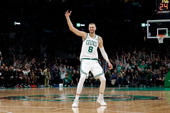 Boston, MA - December 28: Boston Celtics C Kristaps Porzingis celebrates a 3-pointer in the second half. The Celtics beat the Detroit Pistons, 128-122, in overtime. (Photo by Danielle Parhizkaran/The Boston Globe via Getty Images)