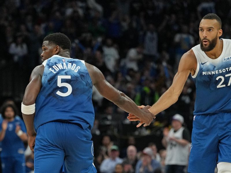 MINNEAPOLIS, MN -  APRIL 9: Rudy Gobert #27 and Anthony Edwards #5 of the Minnesota Timberwolves high five during the game against the Washington Wizards on April 9, 2024 at Target Center in Minneapolis, Minnesota. NOTE TO USER: User expressly acknowledges and agrees that, by downloading and or using this Photograph, user is consenting to the terms and conditions of the Getty Images License Agreement. Mandatory Copyright Notice: Copyright 2024 NBAE (Photo by Jordan Johnson/NBAE via Getty Images)