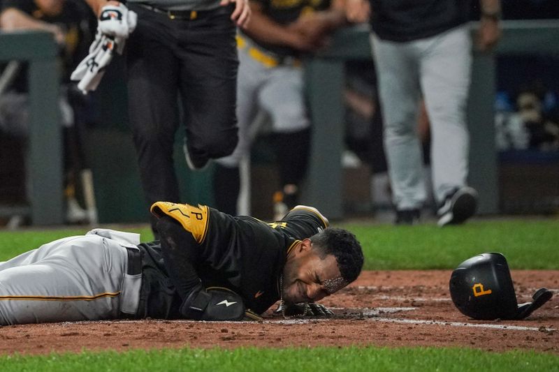Aug 29, 2023; Kansas City, Missouri, USA; Pittsburgh Pirates right fielder Joshua Palacios (54) lays at home plate after a ball hits him in the forehead against the Kansas City Royals in the fifth inning at Kauffman Stadium. Mandatory Credit: Denny Medley-USA TODAY Sports