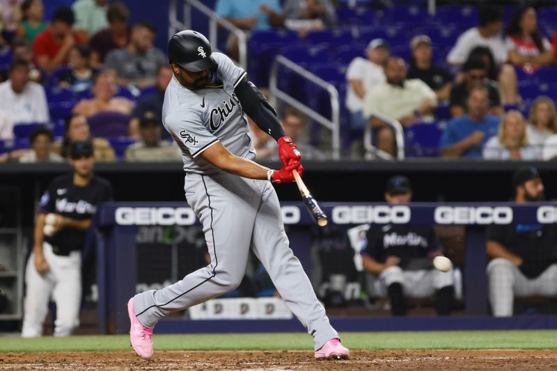 Jul 5, 2024; Miami, Florida, USA; Chicago White Sox designated hitter Eloy Jimenez (74) hits a single against the Miami Marlins during the fifth inning at loanDepot Park. Mandatory Credit: Sam Navarro-USA TODAY Sports