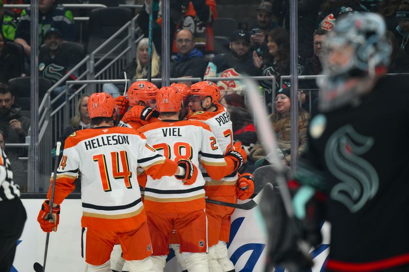 Jan 23, 2026; Seattle, Washington, USA; The Anaheim Ducks celebrate after a goal scored by left wing Cutter Gauthier (61) during the first period against the Seattle Kraken at Climate Pledge Arena. Mandatory Credit: Steven Bisig-Imagn Images