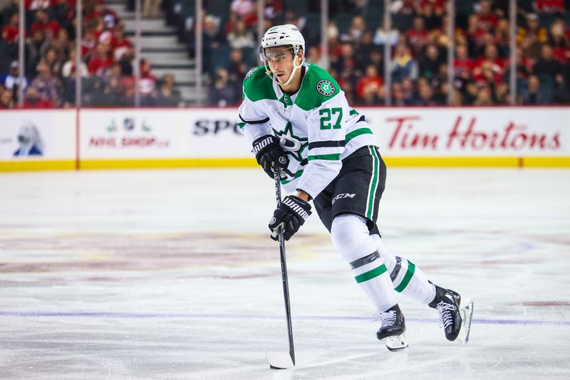 Nov 30, 2023; Calgary, Alberta, CAN; Dallas Stars left wing Mason Marchment (27) scores a goal on a penalty shot during the third period against the Calgary Flames at Scotiabank Saddledome. Mandatory Credit: Sergei Belski-USA TODAY Sports