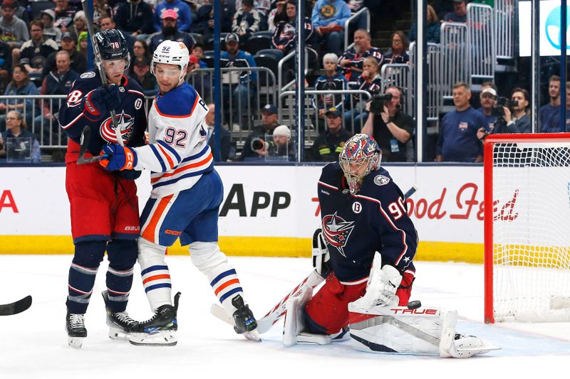 Oct 28, 2024; Columbus, Ohio, USA; Edmonton Oilers right wing Vasily Podkolzin (92) looks for a rebound of as Columbus Blue Jackets goalie Elvis Merzlikins (90) makes a save during the first period at Nationwide Arena. Mandatory Credit: Russell LaBounty-Imagn Images