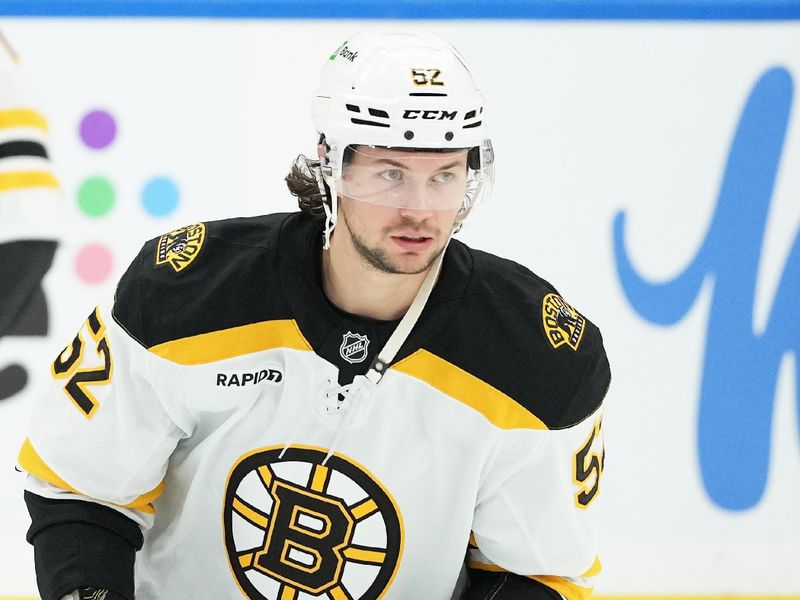 Nov 5, 2024; Toronto, Ontario, CAN; Boston Bruins defenseman Andrew Peeke (52) skates during the warmup before a game against the Toronto Maple Leafs at Scotiabank Arena. Mandatory Credit: Nick Turchiaro-Imagn Imagess