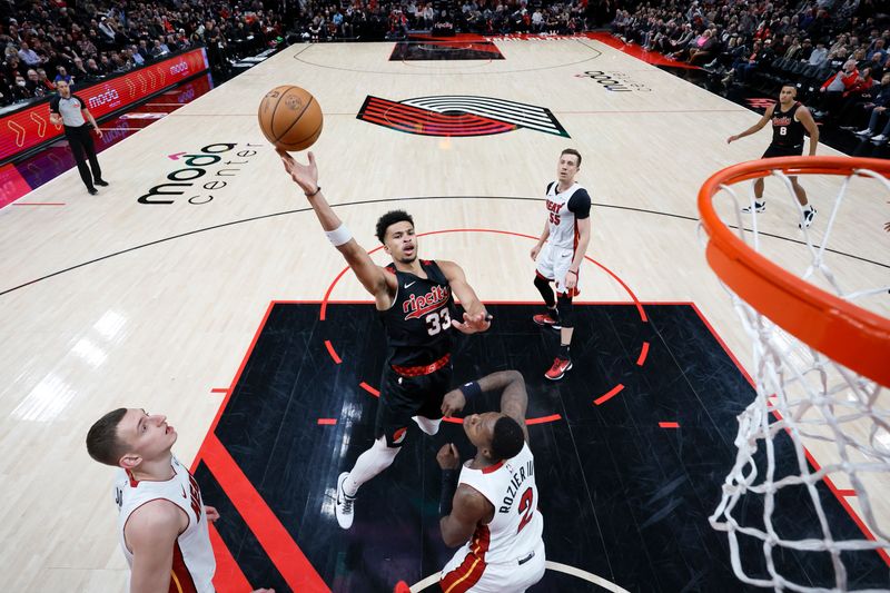 PORTLAND, OREGON - FEBRUARY 27: Toumani Camara #33 of the Portland Trail Blazers shoots the ball against Terry Rozier #2 of the Miami Heat during the first half at Moda Center on February 27, 2024 in Portland, Oregon. NOTE TO USER: User expressly acknowledges and agrees that, by downloading and or using this photograph, User is consenting to the terms and conditions of the Getty Images License Agreement. (Photo by Soobum Im/Getty Images)