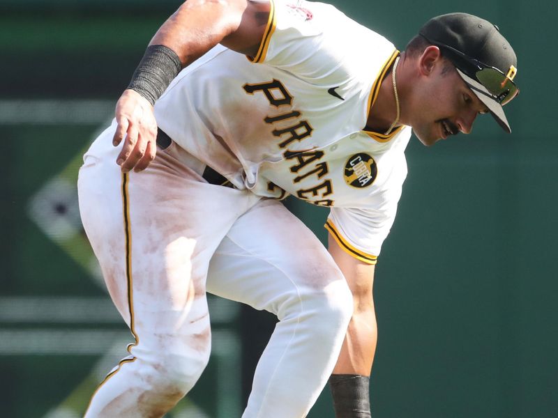 Aug 10, 2025; Pittsburgh, Pennsylvania, USA;  Pittsburgh Pirates second baseman Nick Gonzales (39) fields a ball hit for an infield single by Cincinnati Reds first baseman Spencer Steer (not pitured) during the ninth inning at PNC Park. Mandatory Credit: Charles LeClaire-Imagn Images