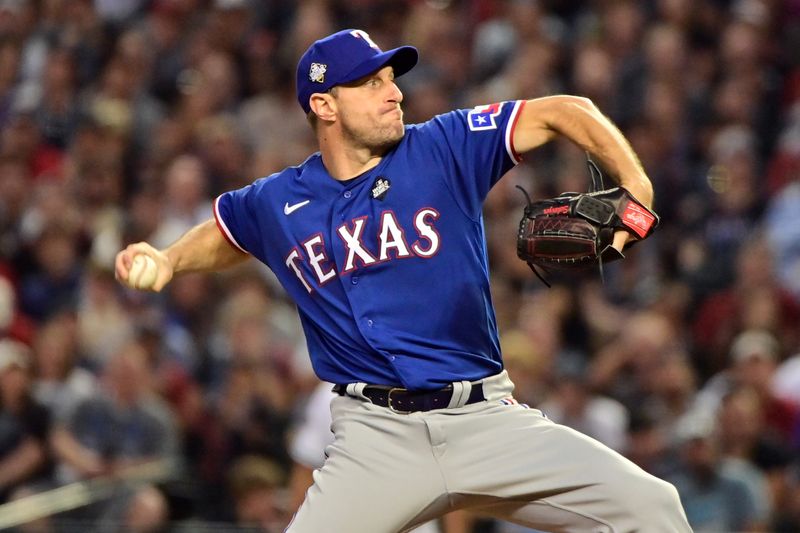 Oct 30, 2023; Phoenix, Arizona, USA; Texas Rangers starting pitcher Max Scherzer (31) pitches in the third inning against the Arizona Diamondbacks in game three of the 2023 World Series at Chase Field. Mandatory Credit: Matt Kartozian-USA TODAY Sports