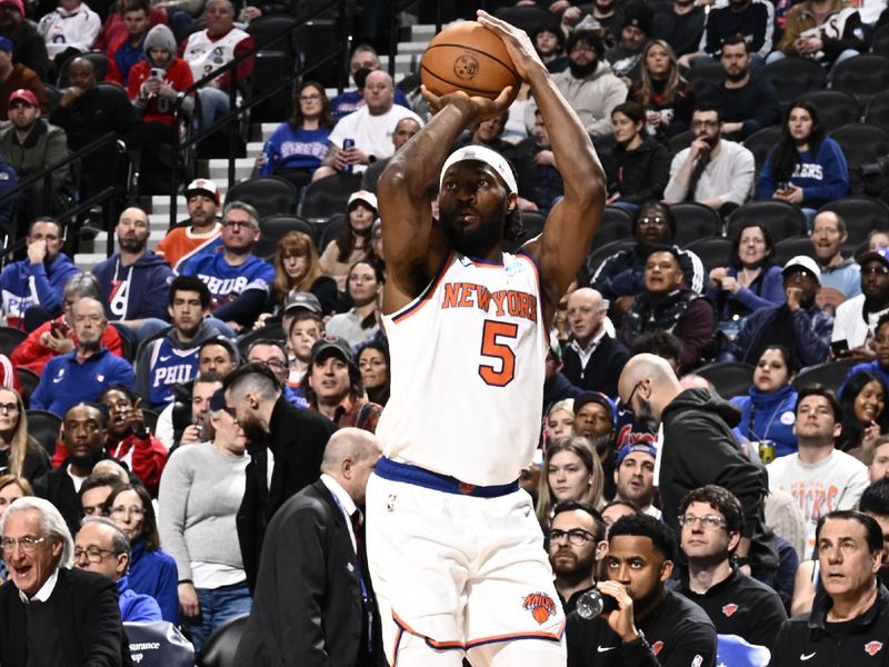 PHILADELPHIA, PA - FEBRUARY 22: Precious Achiuwa #5 of the New York Knicks shoots a three point basket against the Philadelphia 76ers on February 22, 2024 at the Wells Fargo Center in Philadelphia, Pennsylvania NOTE TO USER: User expressly acknowledges and agrees that, by downloading and/or using this Photograph, user is consenting to the terms and conditions of the Getty Images License Agreement. Mandatory Copyright Notice: Copyright 2024 NBAE (Photo by David Dow/NBAE via Getty Images)