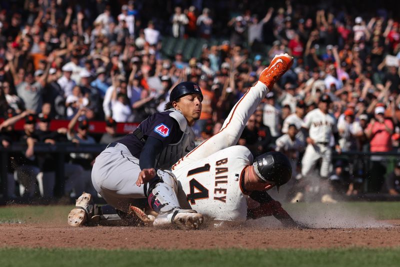 Sep 13, 2023; San Francisco, California, USA; San Francisco Giants catcher Patrick Bailey (14) scores the winning run during the tenth inning against the Cleveland Guardians at Oracle Park. Mandatory Credit: Sergio Estrada-USA TODAY Sports