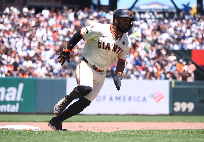 Jun 30, 2024; San Francisco, California, USA; San Francisco Giants center fielder Heliot Ramos (17) rounds third base to score the second run of a two RBI double against the Los Angeles Dodgers during the fourth inning at Oracle Park. Mandatory Credit: Kelley L Cox-USA TODAY Sports