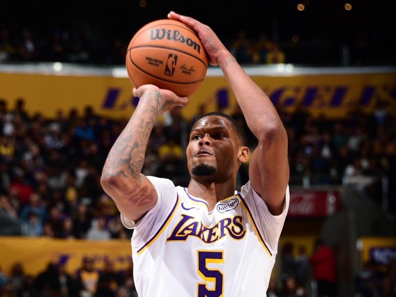 LOS ANGELES, CA - DECEMBER 8: Cam Reddish #5 of the Los Angeles Lakers shoots a free throw during the game against the Portland Trail Blazers on December 8, 2024 at Crypto.Com Arena in Los Angeles, California. NOTE TO USER: User expressly acknowledges and agrees that, by downloading and/or using this Photograph, user is consenting to the terms and conditions of the Getty Images License Agreement. Mandatory Copyright Notice: Copyright 2024 NBAE (Photo by Adam Pantozzi/NBAE via Getty Images)