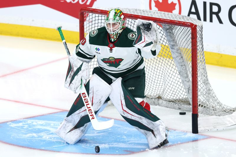 Dec 27, 2025; Winnipeg, Manitoba, CAN; Minnesota Wild goaltender Jesper Wallstedt (30) warms up before a game against the Winnipeg Jets at Canada Life Centre. Mandatory Credit: James Carey Lauder-Imagn Images