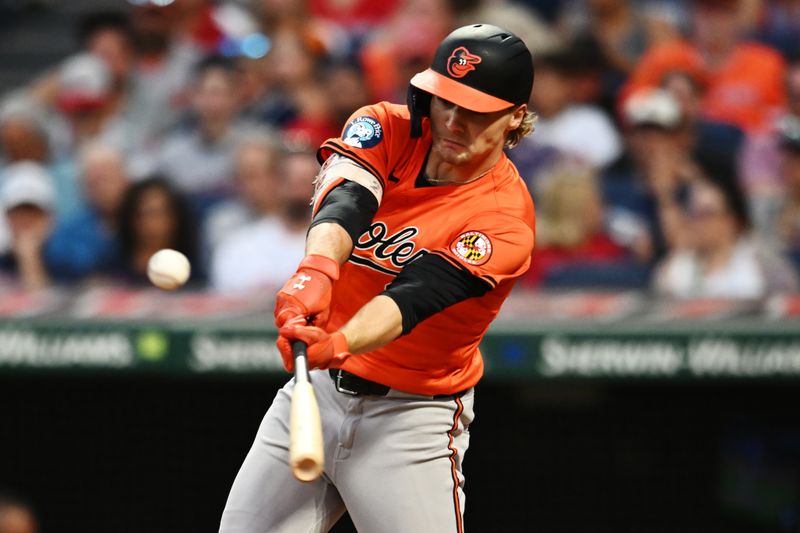 Aug 3, 2024; Cleveland, Ohio, USA; Baltimore Orioles shortstop Gunnar Henderson (2) hits an RBI single during the fifth inning against the Cleveland Guardians at Progressive Field. Mandatory Credit: Ken Blaze-USA TODAY Sports