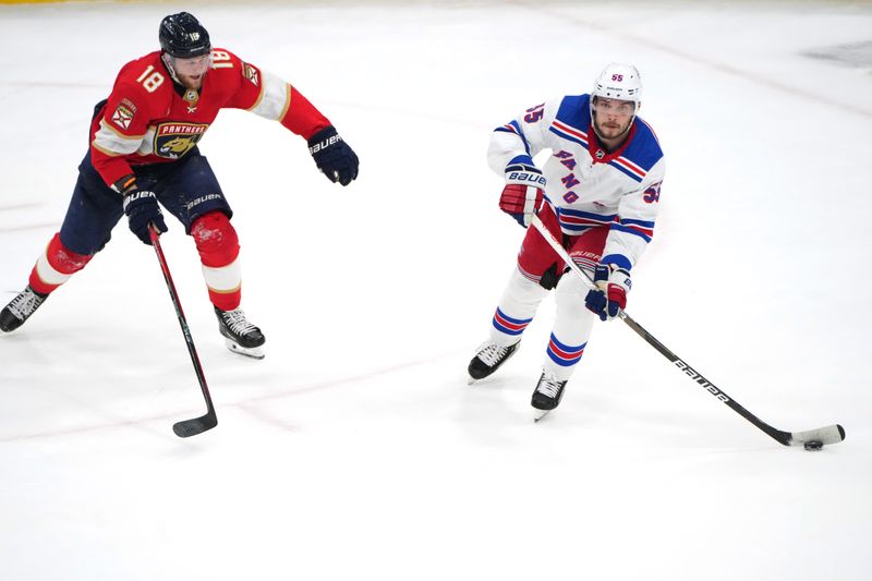 Jun 1, 2024; Sunrise, Florida, USA; New York Rangers defenseman Ryan Lindgren (55) brings the puck up the ice as Florida Panthers center Steven Lorentz (18) closes in during the second period in game six of the Eastern Conference Final of the 2024 Stanley Cup Playoffs at Amerant Bank Arena. Mandatory Credit: Jim Rassol-USA TODAY Sports