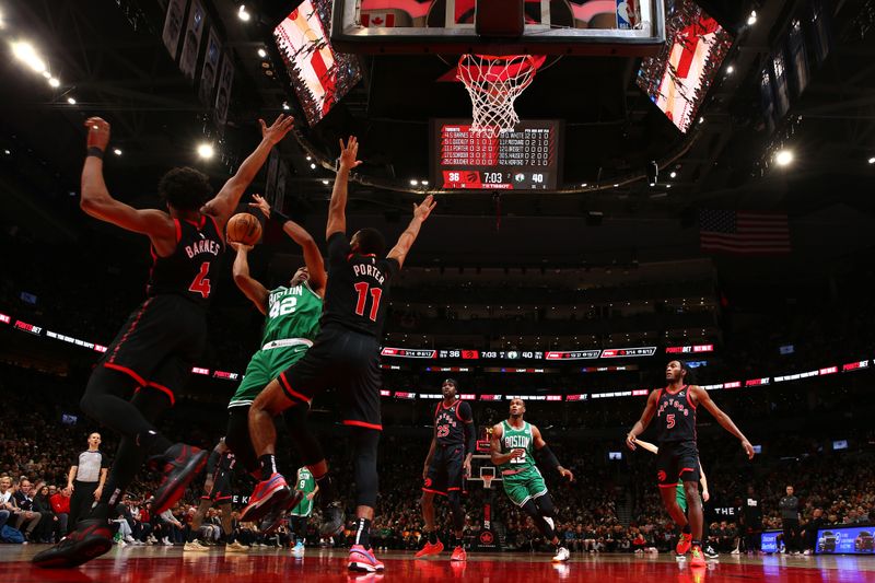 TORONTO, CANADA - JANUARY 15:  Al Horford #42 of the Boston Celtics drives to the basket during the game against the Toronto Raptors on January 15, 2024 at the Scotiabank Arena in Toronto, Ontario, Canada.  NOTE TO USER: User expressly acknowledges and agrees that, by downloading and or using this Photograph, user is consenting to the terms and conditions of the Getty Images License Agreement.  Mandatory Copyright Notice: Copyright 2024 NBAE (Photo by Vaughn Ridley/NBAE via Getty Images)