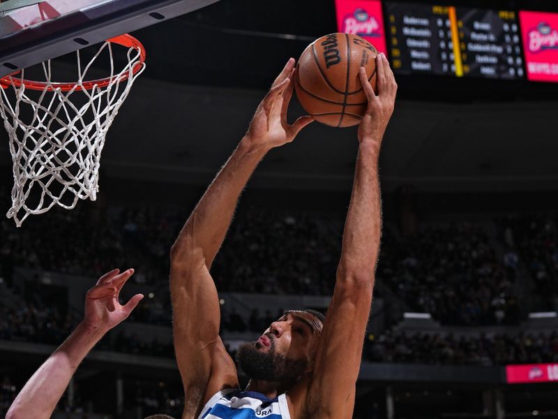 DENVER, CO - APRIL 10: Rudy Gobert #27 of the Minnesota Timberwolves drives to the basket during the game against the Denver Nuggets on April 10, 2024 at the Ball Arena in Denver, Colorado. NOTE TO USER: User expressly acknowledges and agrees that, by downloading and/or using this Photograph, user is consenting to the terms and conditions of the Getty Images License Agreement. Mandatory Copyright Notice: Copyright 2024 NBAE (Photo by Garrett Ellwood/NBAE via Getty Images)