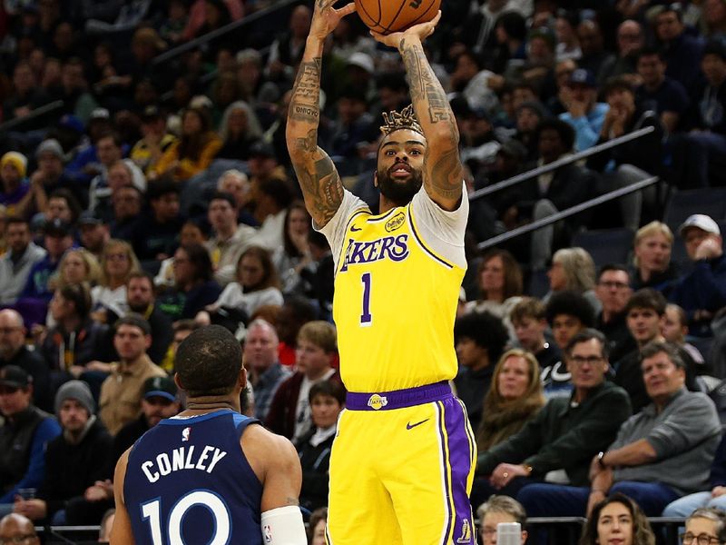 MINNEAPOLIS, MINNESOTA - DECEMBER 13: D'Angelo Russell #1 of the Los Angeles Lakers shoots the ball against Mike Conley #10 of the Minnesota Timberwolves in the third quarter at Target Center on December 13, 2024 in Minneapolis, Minnesota. The Timberwolves defeated the Lakers 97-87. NOTE TO USER: User expressly acknowledges and agrees that, by downloading and or using this photograph, User is consenting to the terms and conditions of the Getty Images License Agreement. (Photo by David Berding/Getty Images)