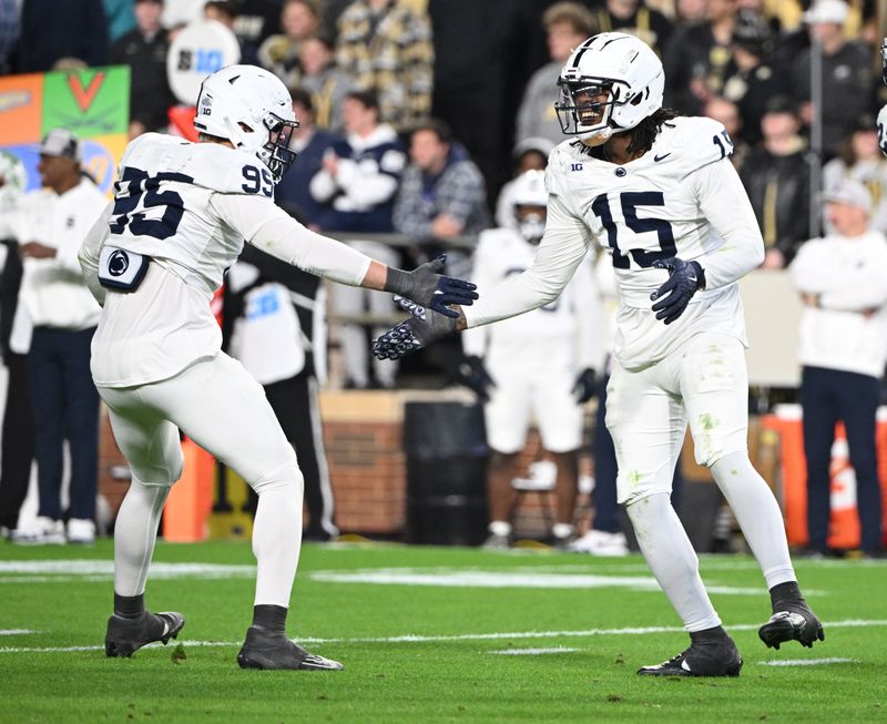 Nov 16, 2024; West Lafayette, Indiana, USA; Penn State Nittany Lions defensive end Amin Vanover (15) celebrates a sack with defensive end Jordan Mayer (95) during the second half against the Purdue Boilermakers at Ross-Ade Stadium. Mandatory Credit: Marc Lebryk-Imagn Images