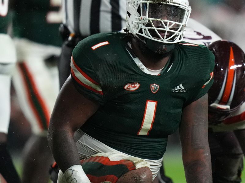 Nov 20, 2021; Miami Gardens, Florida, USA; Miami Hurricanes defensive lineman Nesta Jade Silvera (1) reacts after sacking Virginia Tech Hokies quarterback Connor Blumrick (4) during the second half at Hard Rock Stadium. Mandatory Credit: Jasen Vinlove-USA TODAY Sports