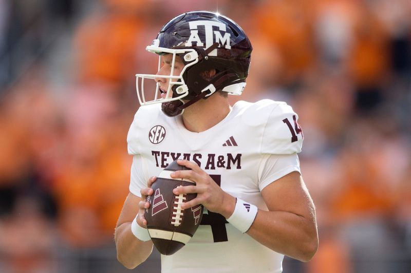 Oct 14, 2023; Knoxville, TN, USA;  Texas A&M quarterback Max Johnson (14) looks to pass during a football game between Tennessee and Texas A&M at Neyland Stadium in Knoxville, Tenn., on Saturday, Oct. 14, 2023. Mandatory Credit: Brianna Paciorka-USA TODAY Sports