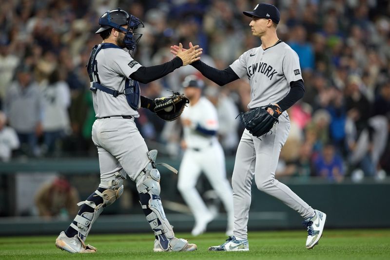 May 14, 2025; Seattle, Washington, USA; New York Yankees pitcher Luke Weaver (30) and New York Yankees catcher third base Pablo Reyes (19) react after the win over the Seattle Mariners at T-Mobile Park. Mandatory Credit: John Froschauer-Imagn Images
