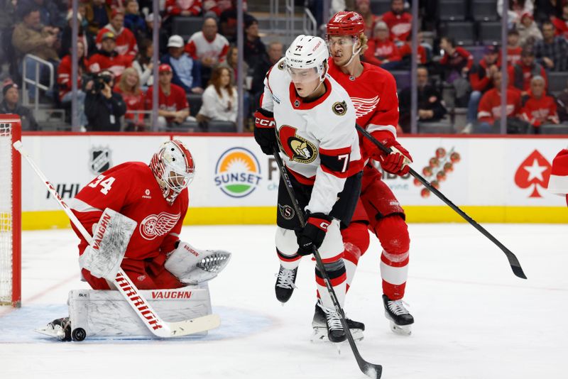 Jan 7, 2025; Detroit, Michigan, USA; Detroit Red Wings goaltender Alex Lyon (34) makes a save on Ottawa Senators center Ridly Greig (71) in the first period at Little Caesars Arena. Mandatory Credit: Rick Osentoski-Imagn Images