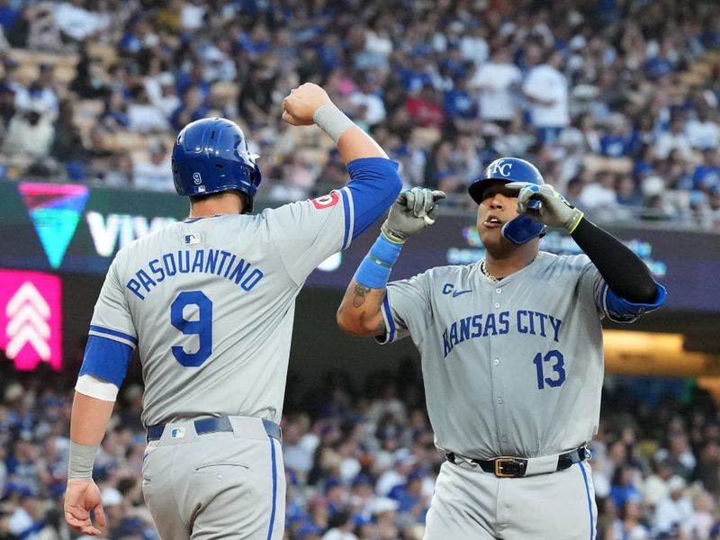 Jun 14, 2024; Los Angeles, California, USA; Kansas City Royals catcher Salvador Perez (13) celebrates with first baseman Vinnie Pasquantino (9) after hitting a three-run home run in the fourth inning against the Los Angeles Dodgers at Dodger Stadium. Mandatory Credit: Kirby Lee-USA TODAY Sports