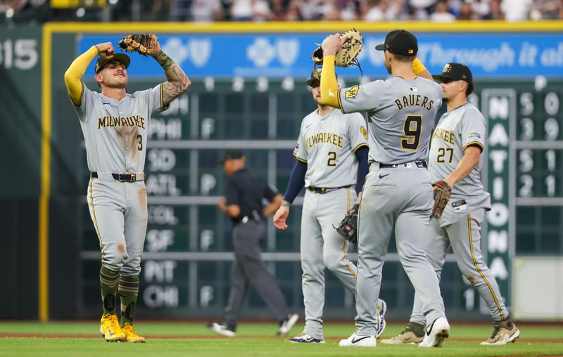 May 18, 2024; Houston, Texas, USA; Milwaukee Brewers third baseman Joey Ortiz (3) and first baseman Jake Bauers (9) and teammates celebrate defeating the Houston Astros at Minute Maid Park. Mandatory Credit: Thomas Shea-USA TODAY Sports