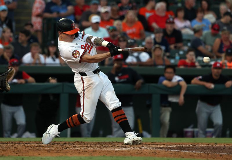 Mar 14, 2025; Sarasota, Florida, USA;  Baltimore Orioles outfielder Tyler O'Neill (9) singles during the fourth inning against the Minnesota Twins at Ed Smith Stadium. Mandatory Credit: Kim Klement Neitzel-Imagn Images