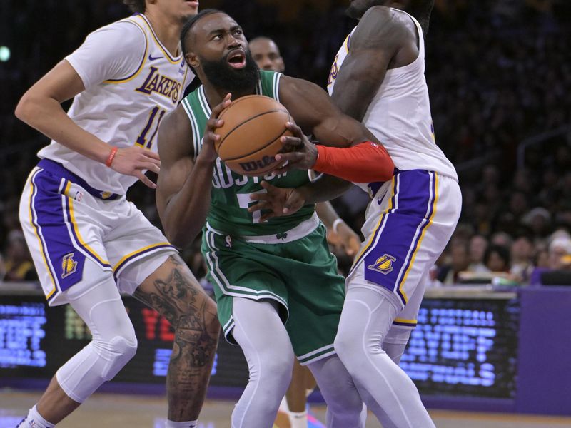 LOS ANGELES, CALIFORNIA - DECEMBER 25: Jaylen Brown #7 of the Boston Celtics drives in between Jaxson Hayes #11 and Taurean Prince #12 of the Los Angeles Lakers in the second half at Crypto.com Arena on December 25, 2023 in Los Angeles, California. NOTE TO USER: User expressly acknowledges and agrees that, by downloading and or using this photograph, User is consenting to the terms and conditions of the Getty Images License Agreement.(Photo by Jayne Kamin-Oncea/Getty Images)