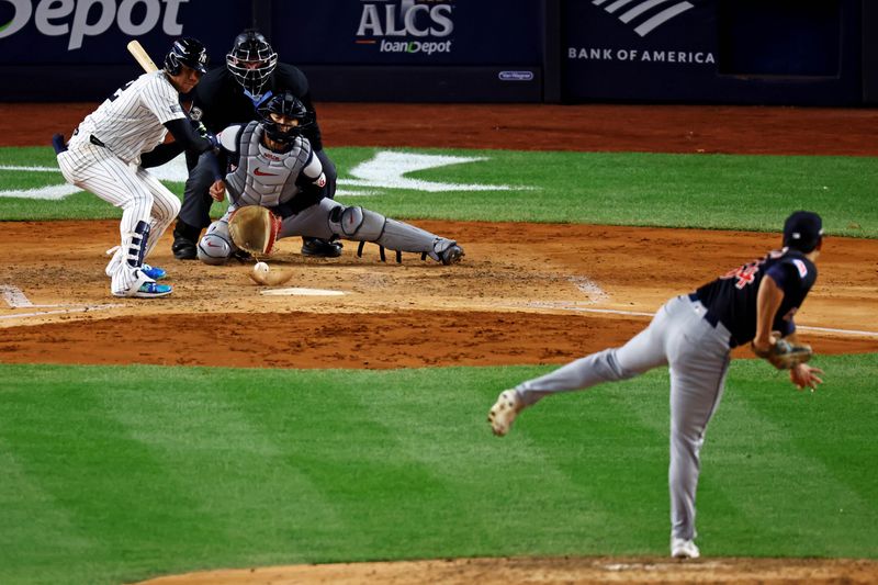 Oct 14, 2024; Bronx, New York, USA; Cleveland Guardians pitcher Joey Cantillo (54) throws a wild pitch to New York Yankees outfielder Juan Soto (22) during the fourth inning the in game one of the ALCS for the 2024 MLB Playoffs at Yankee Stadium. Mandatory Credit: Vincent Carchietta-Imagn Images